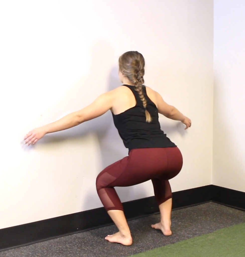 Wall spacing squats posture 2